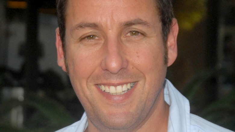 Adam Sandler smiles