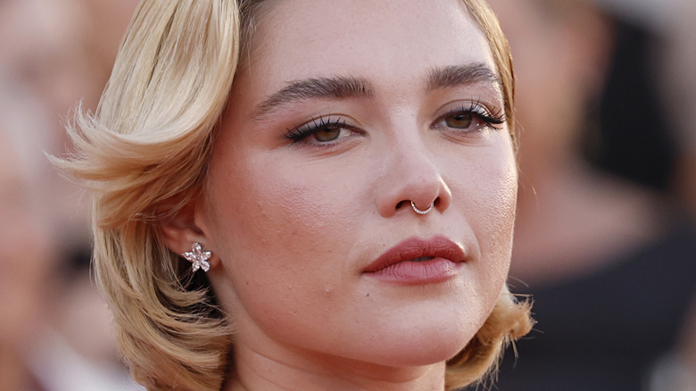 Florence Pugh eyes half closed on red carpet