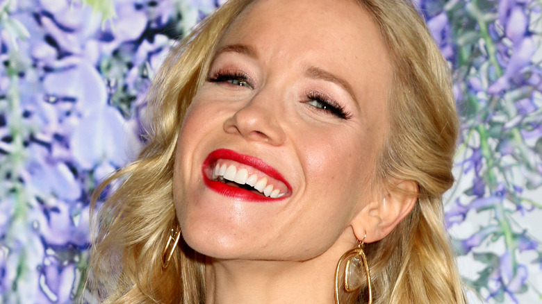 Jessy Schram smiling at a red carpet event