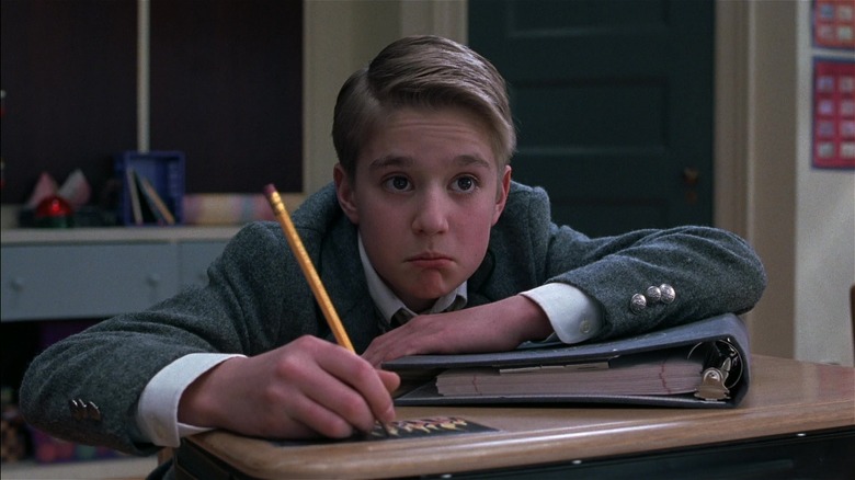 Freddy drawing on his desk